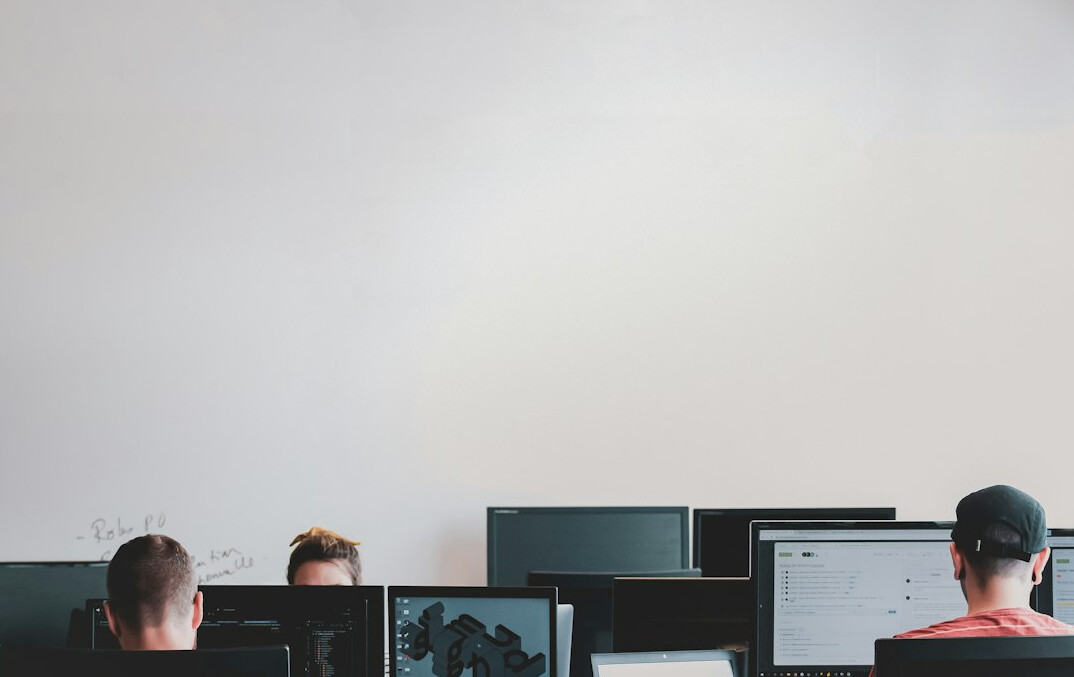 team of developers coding insurance software